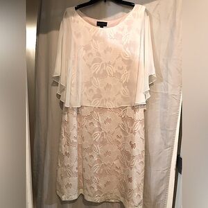 Lacy, dressy dress. Peach lining with cream colored lace. Size 16